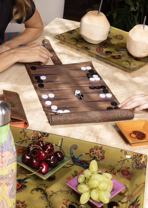 Table set with ETRO HOME designer tableware, drinkware and a backgammon board for summer entertaining