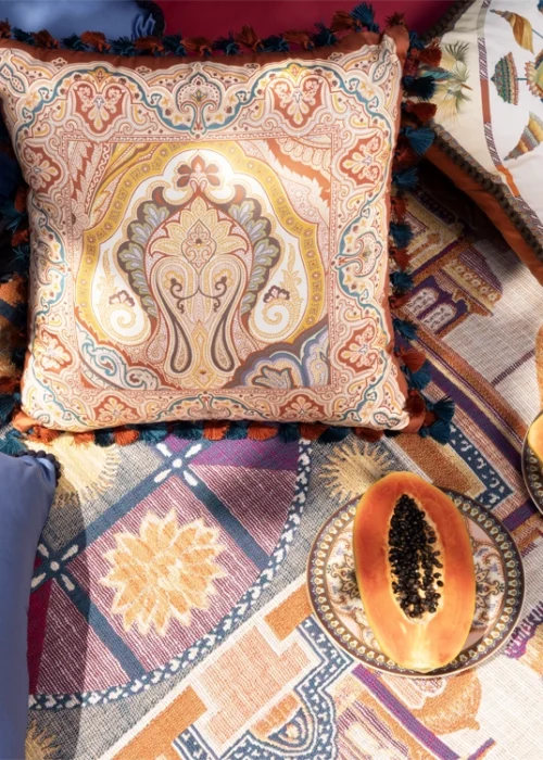 Luxury ETRO Home cushions, designer textiles, patterned rug, and decorative tableware styled for sophisticated home interiors and elegant living spaces